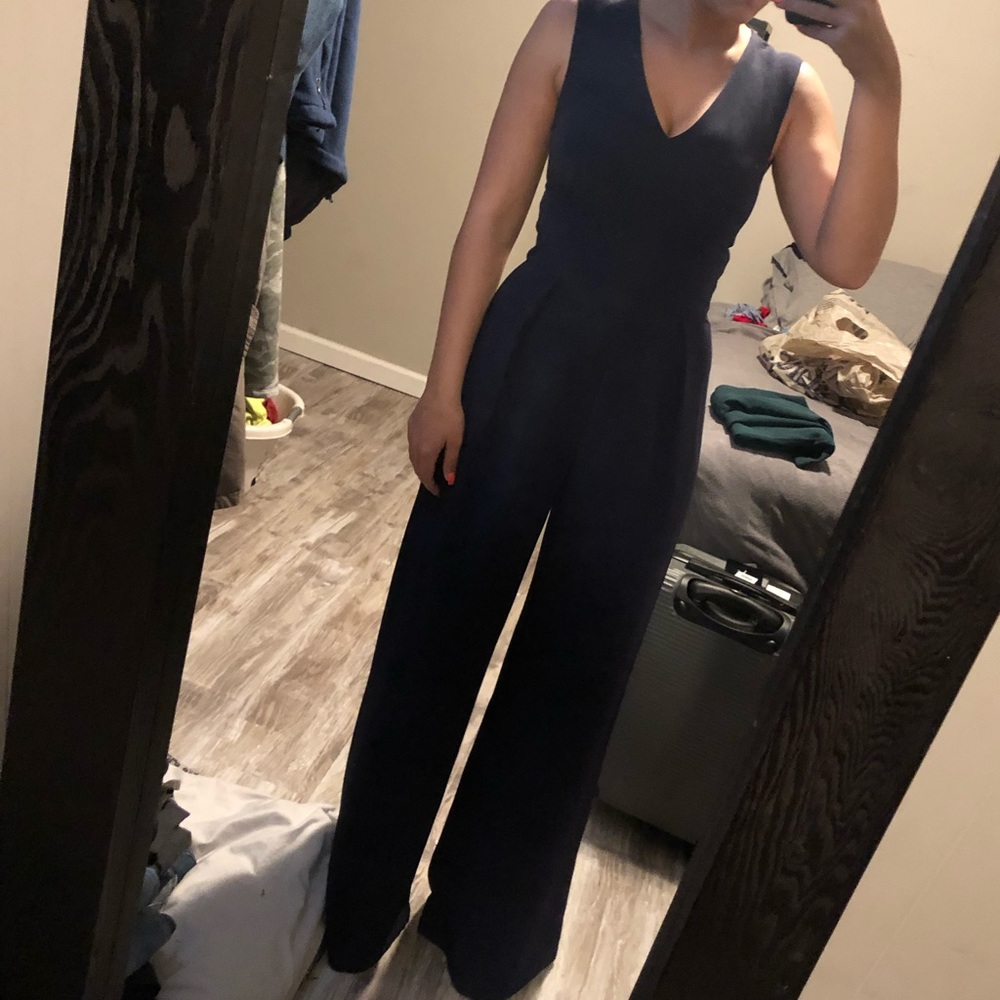 wide leg pleated waist navy jumpsuit